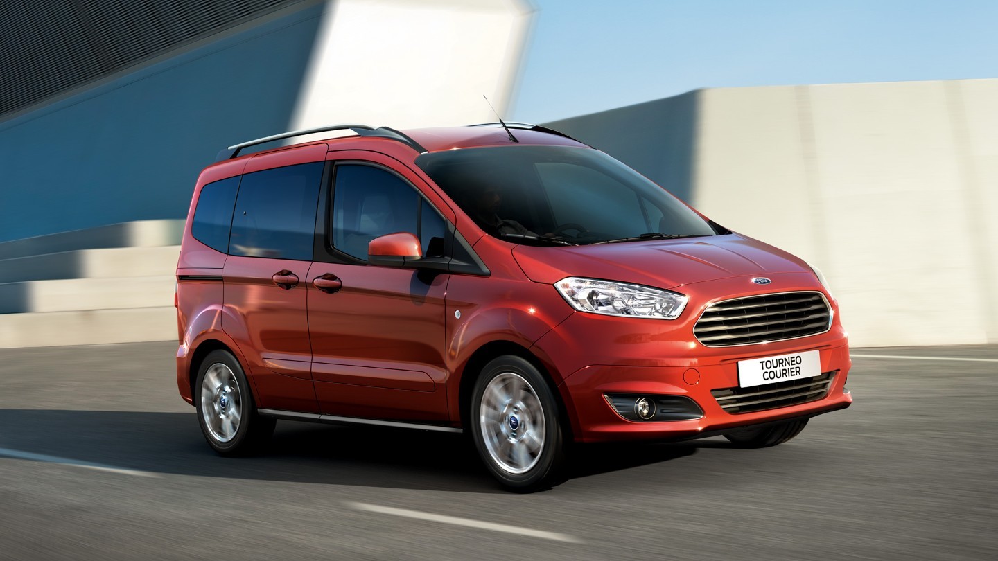 Red Tourneo Courier driving in the city