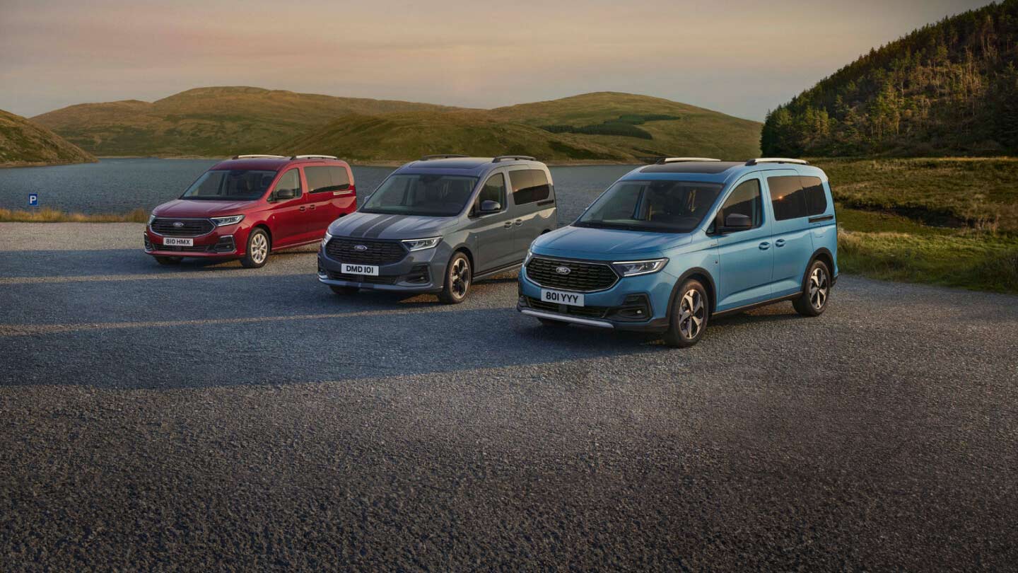 Ford Tourneo family cars parked near lake