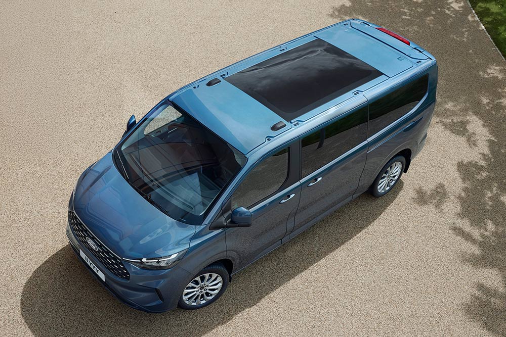 Aerial view of a blue Ford Tourneo Custom, highlighting its panoramic sunroof.