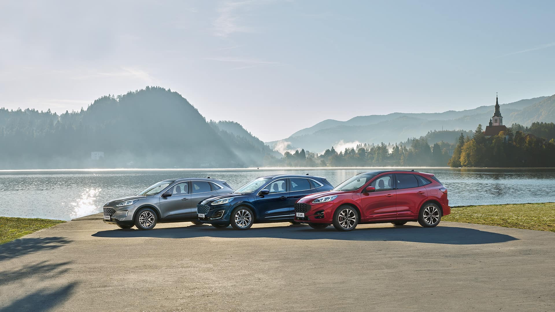 Ford Kuga model range parked by a lake