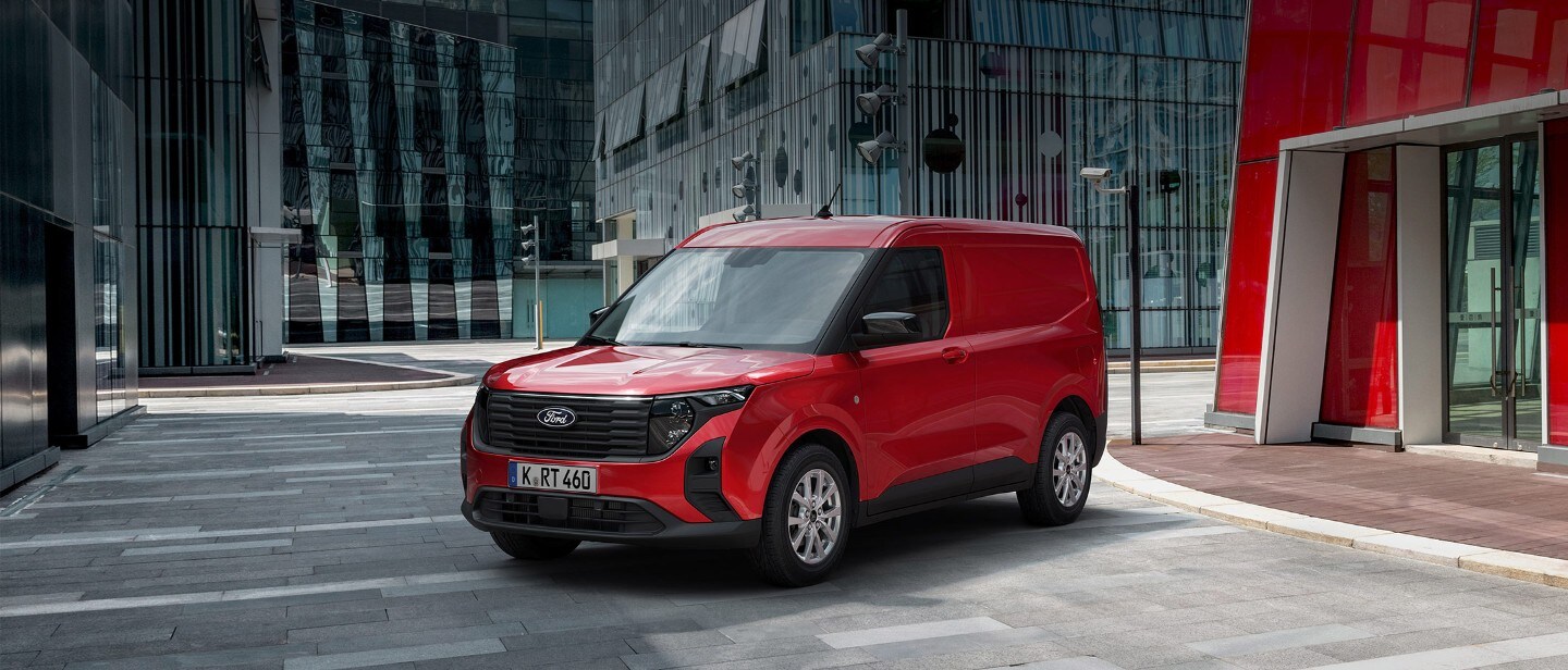 Ford Transit Courier in red parked