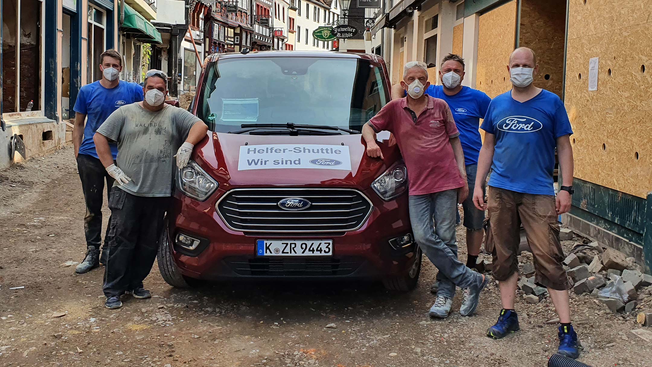 Men next to the Ford Van