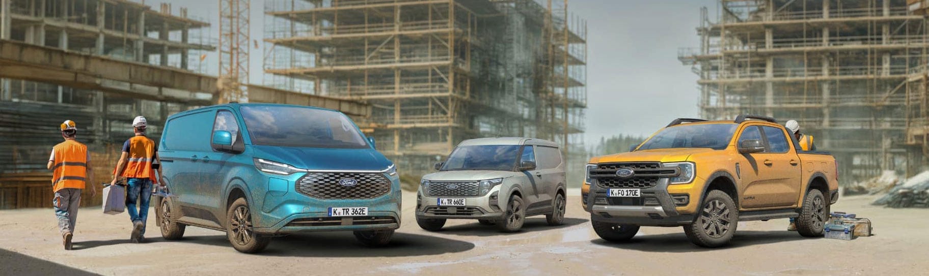 Fleet of Ford Transits in a showroom with a city skyline at dusk in the background.