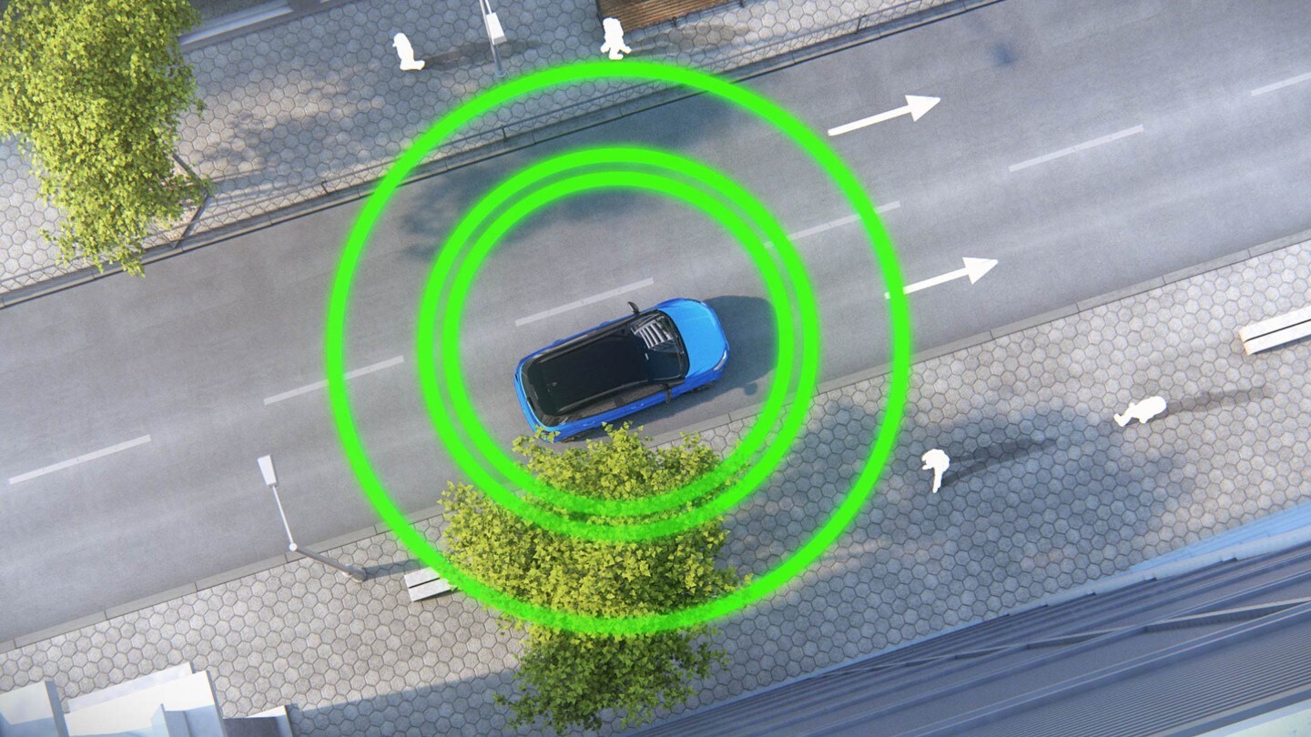 Ford EcoSport in blau. Dachansicht. Fahrend auf einer Straße mit drei grünen Kreisen darum