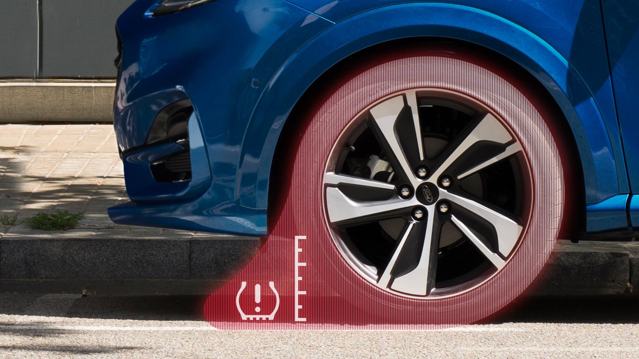 Ford Puma, Detailansicht Reifen, der rot eingefärbt ist mit einer Skala daneben und dem Reifendruckkontroll-Icon