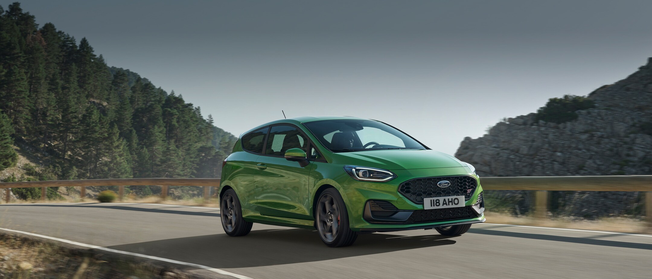 Green Ford Fiesta ST driving on track