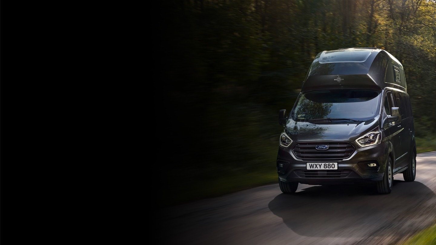 Ford Transit Custom driving on rural road