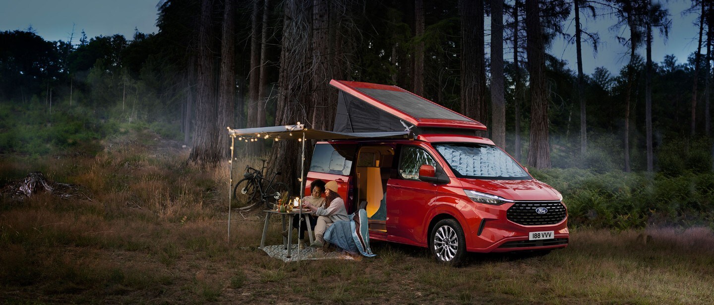 All-New Ford Transit Custom Nugget parked in forest with people sitting in front