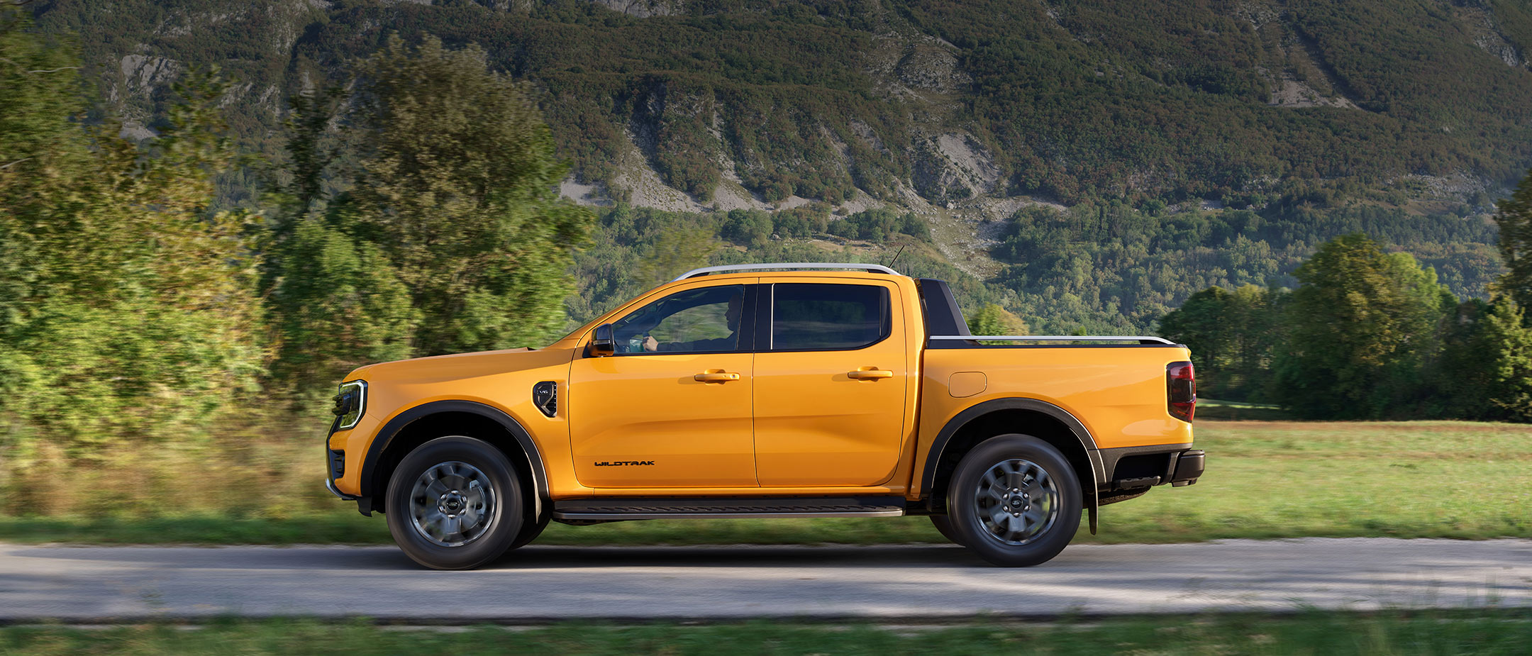 All-New Ford Ranger side view driving on county road